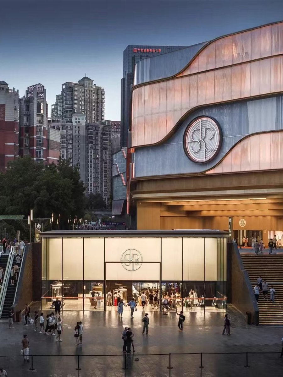 Commercial complex exterior and retail entrance.