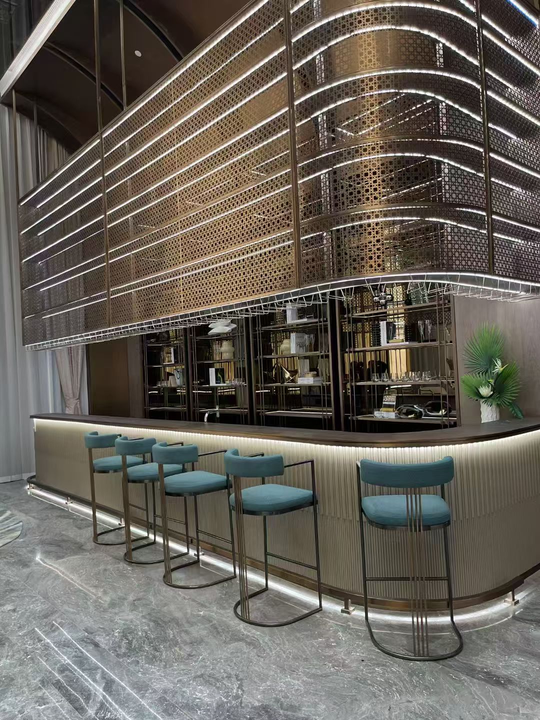 High-end hospitality bar with custom metalwork and lighting.