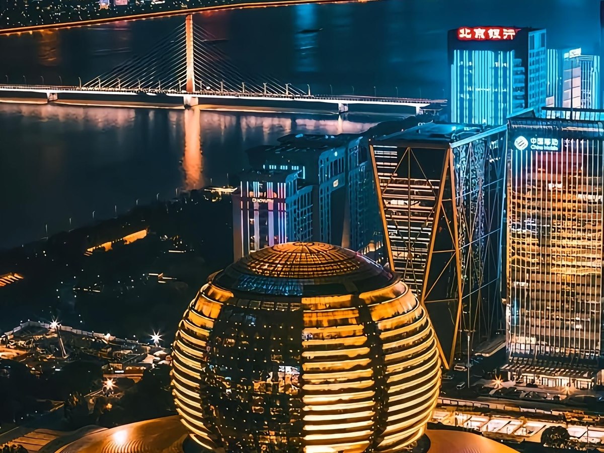 Hotel skyline and illuminated signature lounge destination.